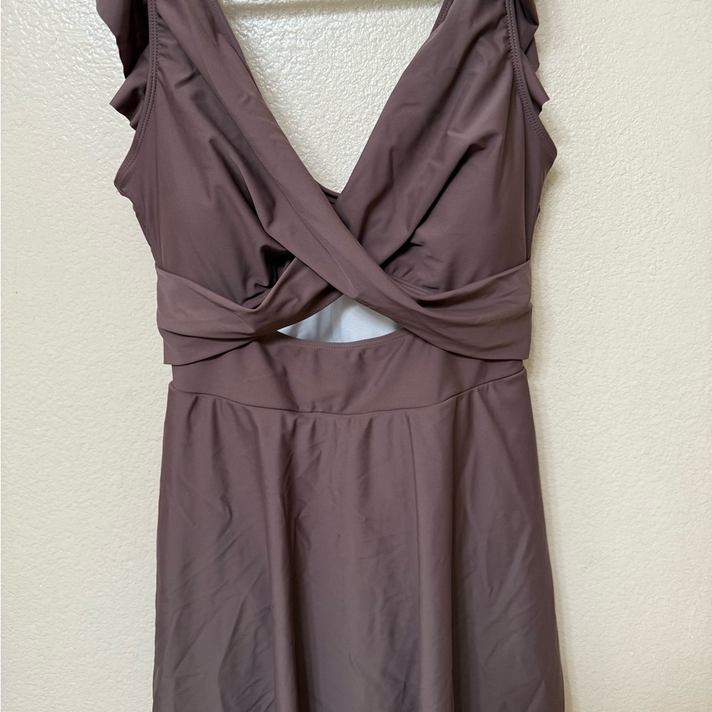 Women 1pc lined w/skirt & crossover style top w/exposed mid drift & ruffle sraps
